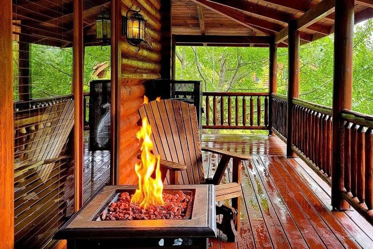 Covered porch with fire pit surrounded by trees